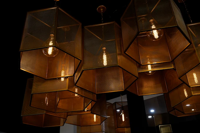 Honeycomb pendant lights illuminating the dining room